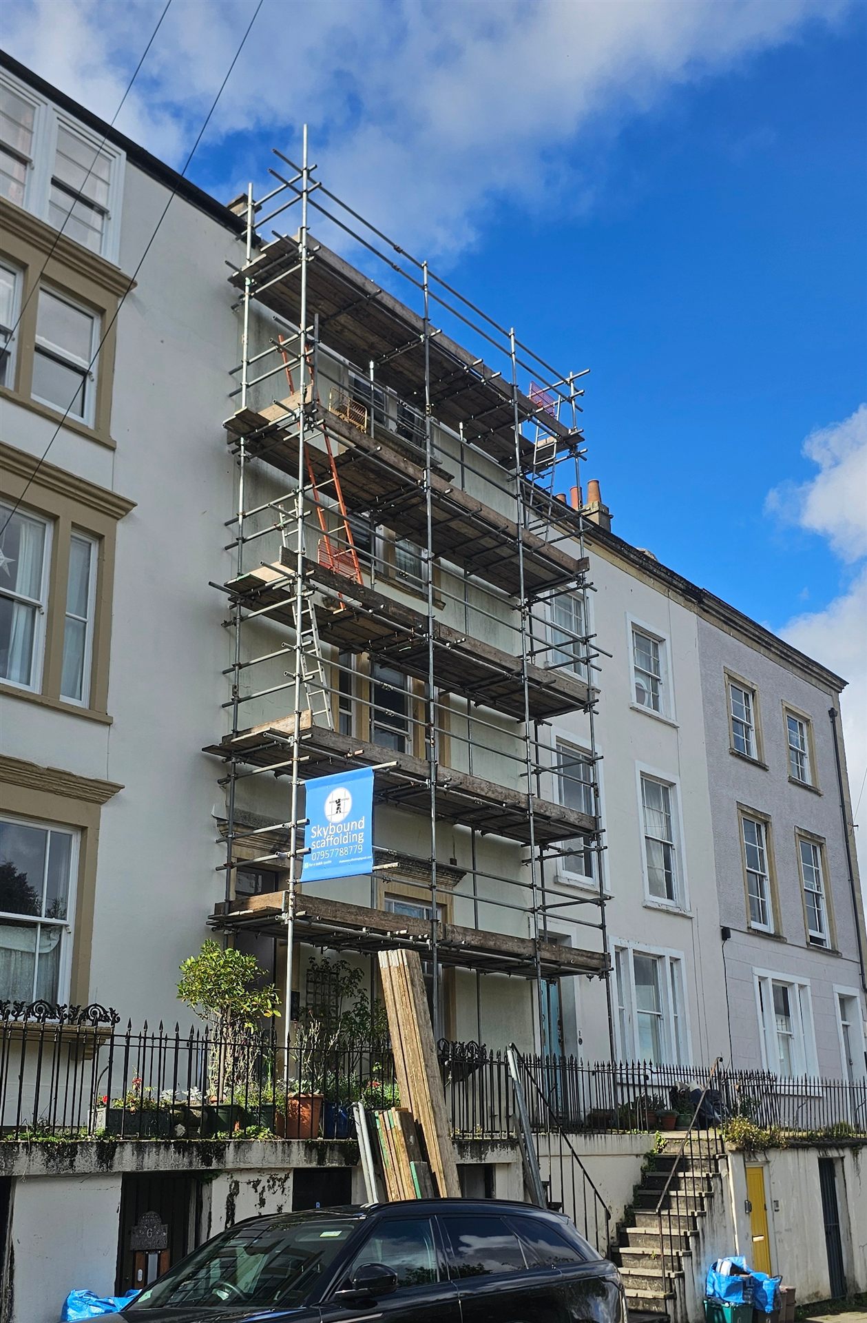 Multi-level scaffold platform on a residential property